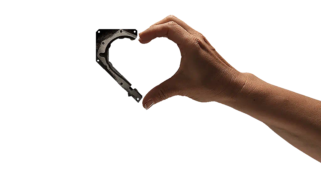 Human hand and a tool shaping the form of a heart