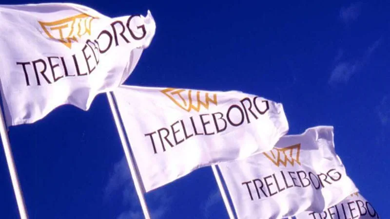Flags with Trelleborg logo with a blue sky in the background