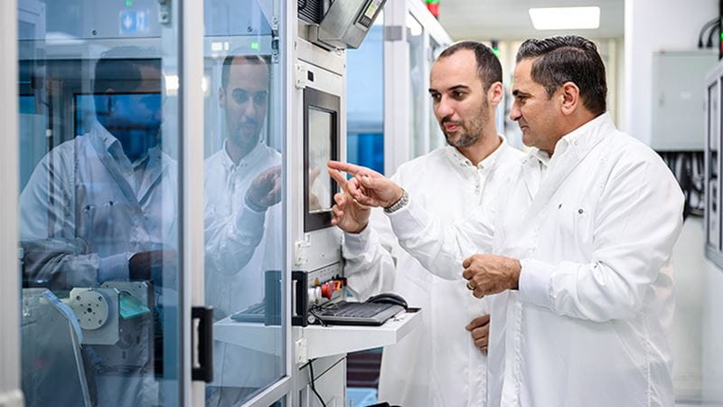 Gordon Micallef inspects data together with colleague at Trelleborg’s factory in Malta.