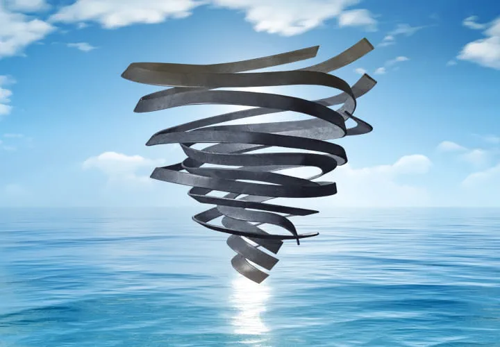 Rubber-shaped tornado above a calm ocean under a bright blue sky