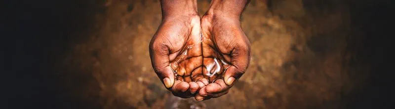 Hands holding water