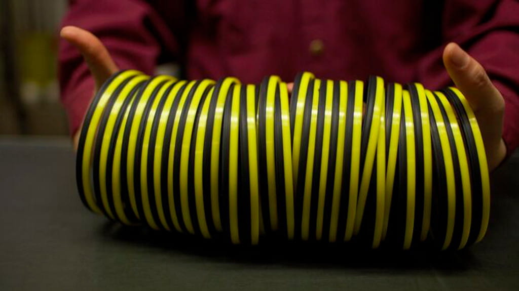 Hands holding Trelleborg Din-Lock seals